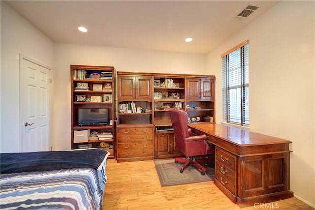 office with light hardwood / wood-style flooring