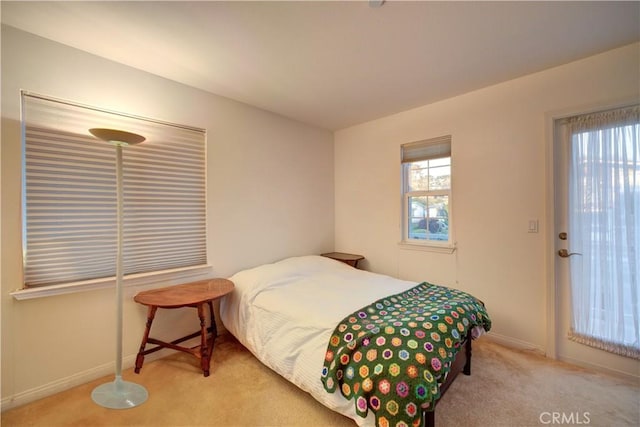 bedroom with light carpet