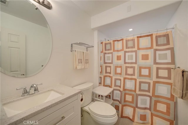 bathroom with a shower with curtain, vanity, and toilet