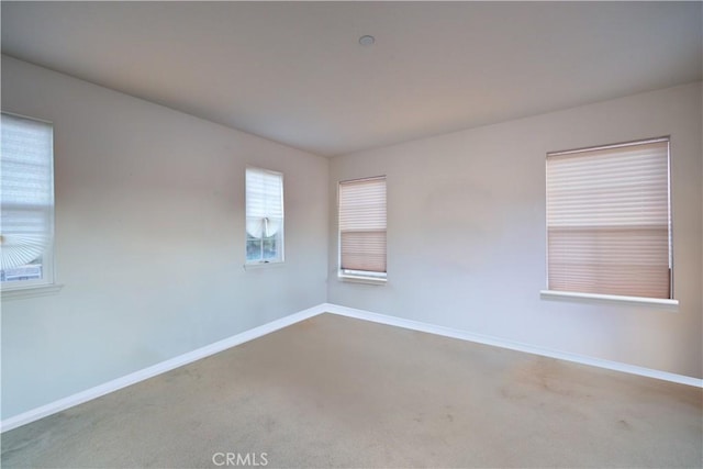 unfurnished room featuring carpet flooring