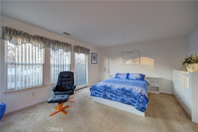 bedroom featuring light colored carpet