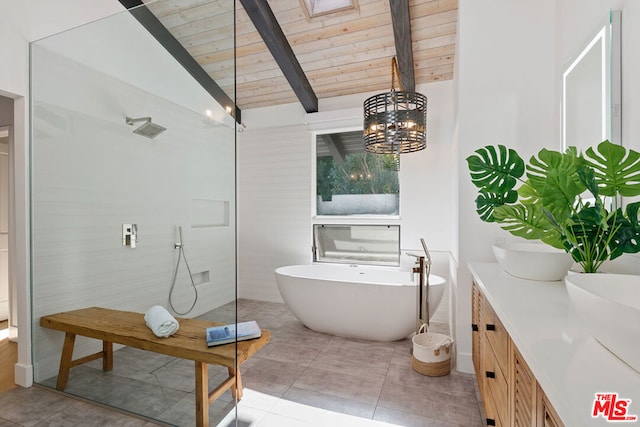 bathroom featuring tile patterned floors, vaulted ceiling with beams, a bathing tub, an inviting chandelier, and wood ceiling