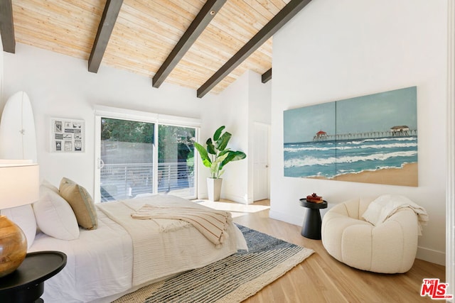 bedroom featuring high vaulted ceiling, wood ceiling, hardwood / wood-style flooring, and beamed ceiling