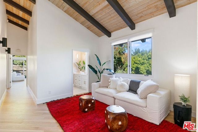 living room with beam ceiling, light hardwood / wood-style flooring, wood ceiling, and high vaulted ceiling