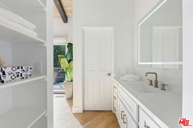 bathroom featuring wooden ceiling, plenty of natural light, wood-type flooring, and beam ceiling