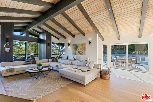 living room featuring high vaulted ceiling, wood ceiling, beamed ceiling, and hardwood / wood-style floors