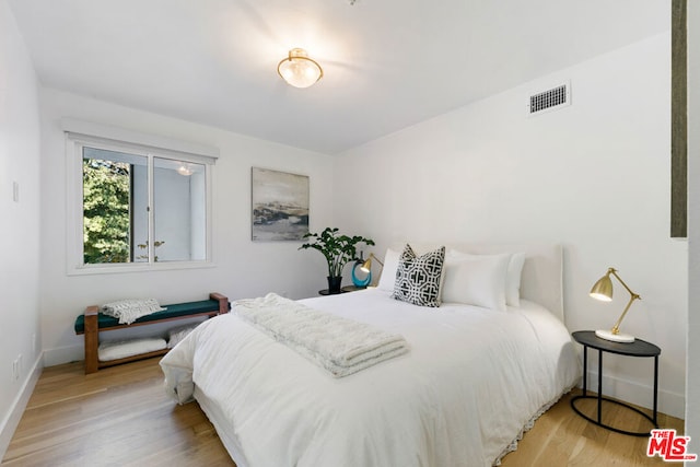 bedroom with light hardwood / wood-style flooring