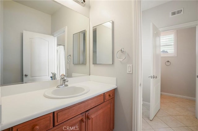 bathroom with vanity and tile patterned floors