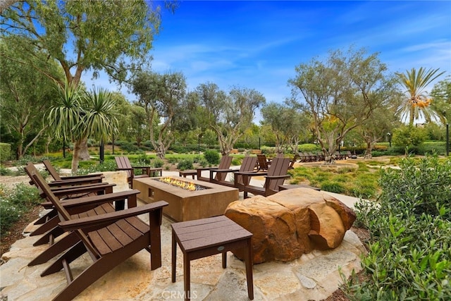 view of property's community featuring a fire pit