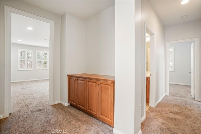 hallway with light carpet