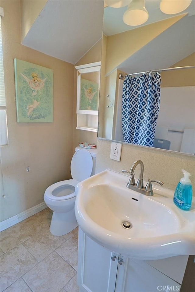 bathroom with vanity, a shower with curtain, tile patterned floors, and toilet