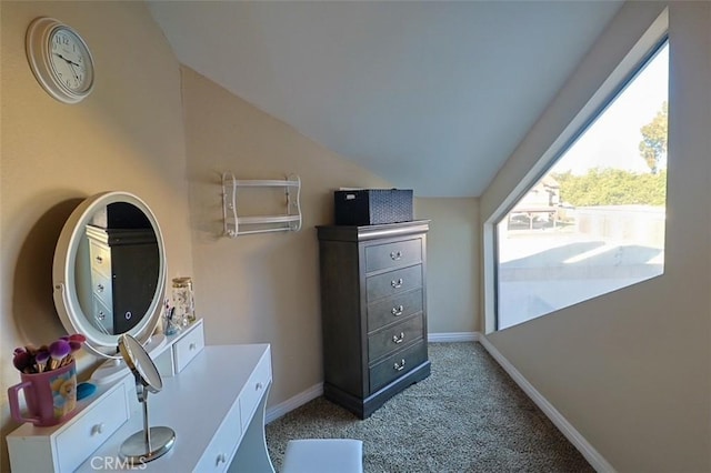 interior space with lofted ceiling and carpet