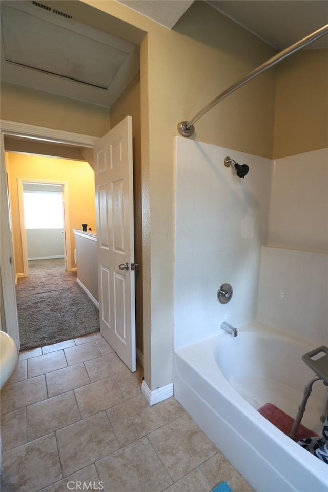 bathroom with shower / bath combination and tile patterned floors