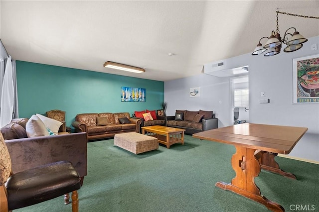 living room with carpet and a notable chandelier