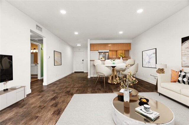 living room with dark wood-type flooring