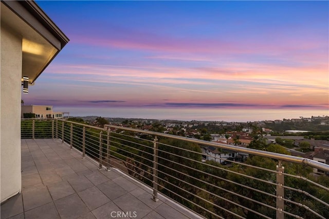 view of balcony at dusk