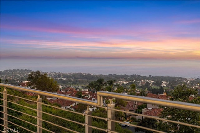 view of balcony at dusk