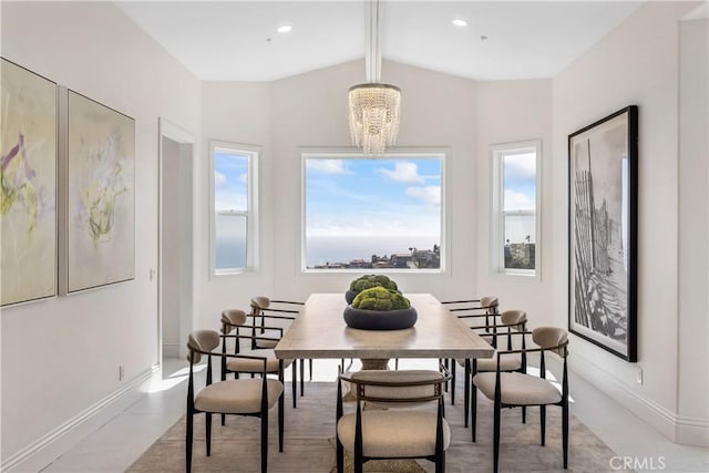 dining room featuring an inviting chandelier and vaulted ceiling with beams