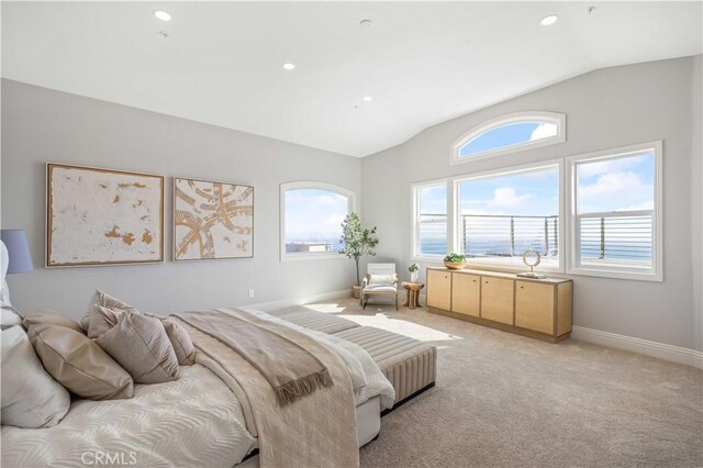 carpeted bedroom featuring vaulted ceiling