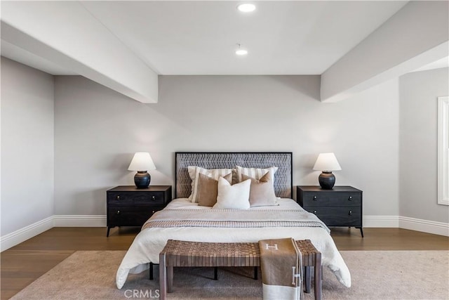 bedroom with hardwood / wood-style flooring