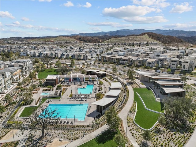 birds eye view of property with a mountain view