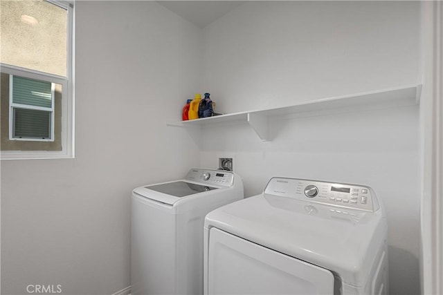 laundry room with washing machine and clothes dryer