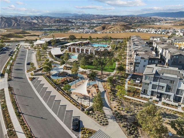 birds eye view of property featuring a mountain view