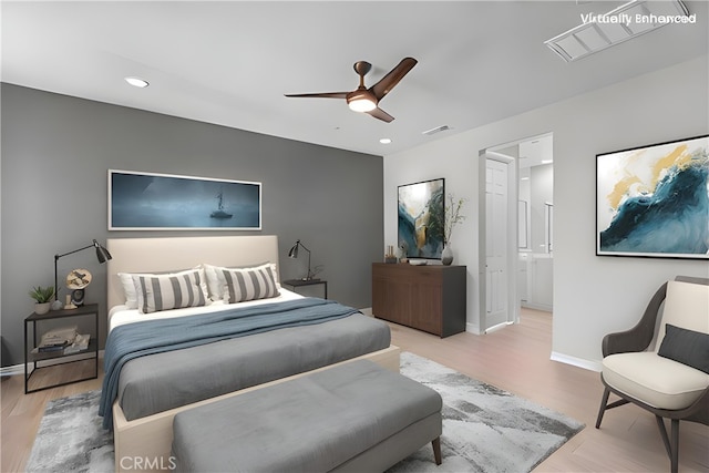 bedroom with ceiling fan and light hardwood / wood-style flooring