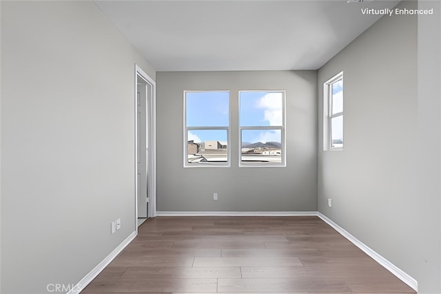 empty room featuring hardwood / wood-style flooring