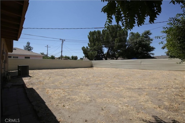 view of yard featuring central air condition unit