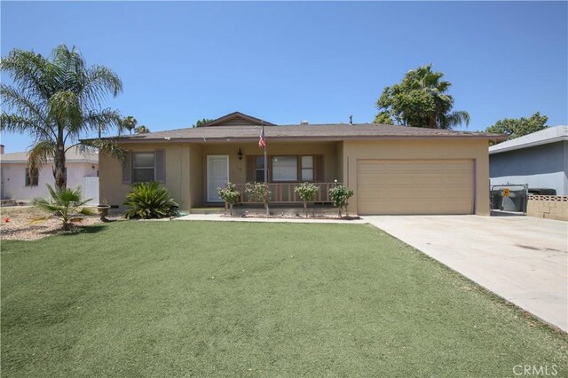 ranch-style house featuring a front lawn and a garage