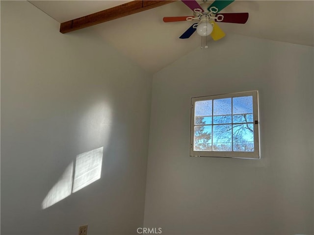 interior space with ceiling fan and beamed ceiling