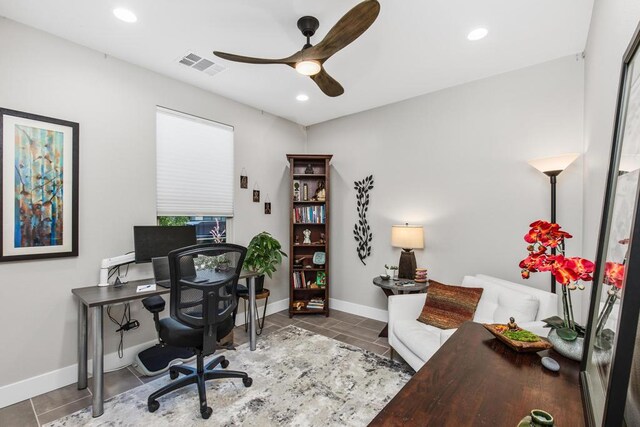 home office featuring ceiling fan and tile patterned flooring