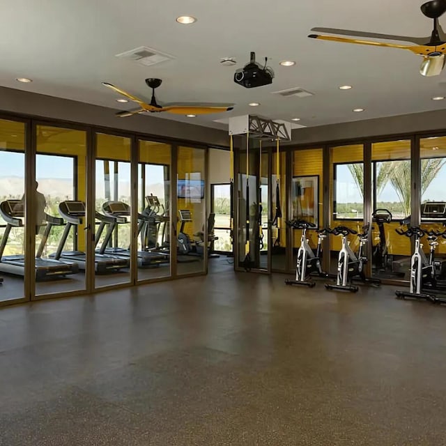 exercise room with ceiling fan