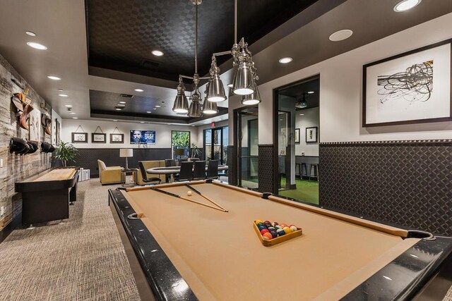 recreation room featuring carpet, pool table, and a tray ceiling