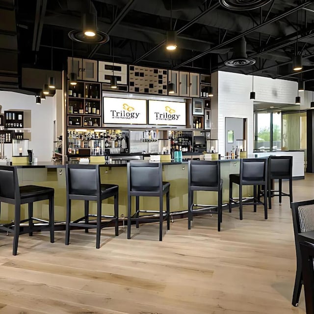 bar featuring hardwood / wood-style flooring