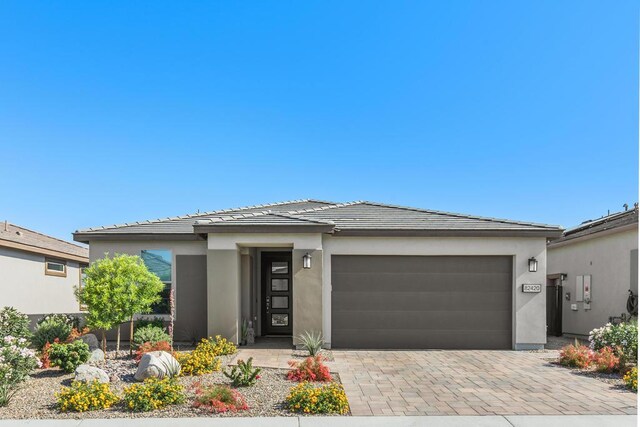 prairie-style home featuring a garage