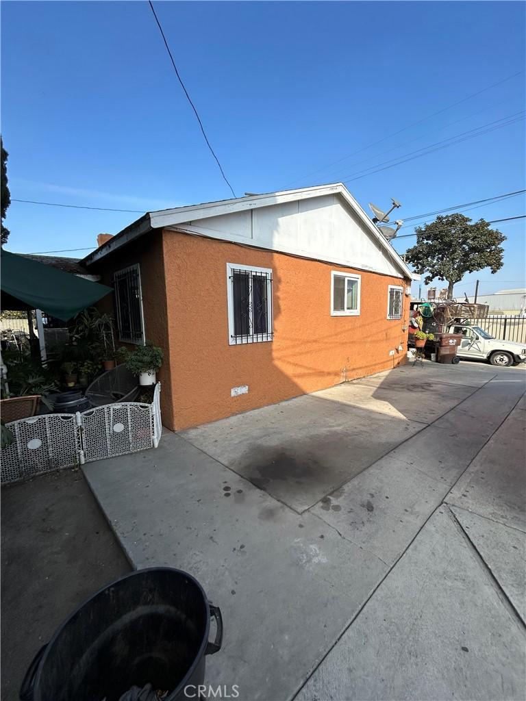 view of side of property featuring a patio area