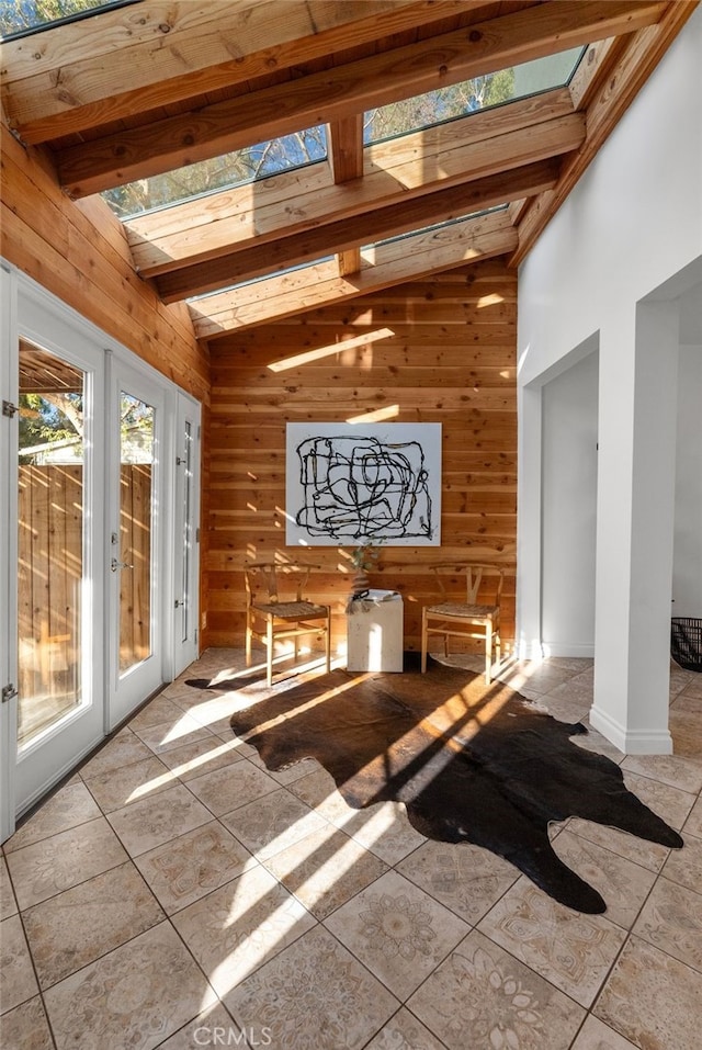 interior space with a healthy amount of sunlight and vaulted ceiling with beams