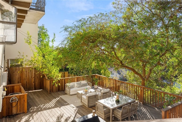 wooden deck featuring an outdoor living space