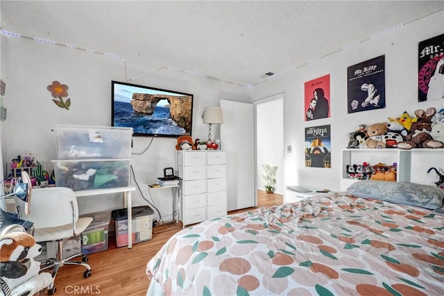 bedroom with light wood-type flooring