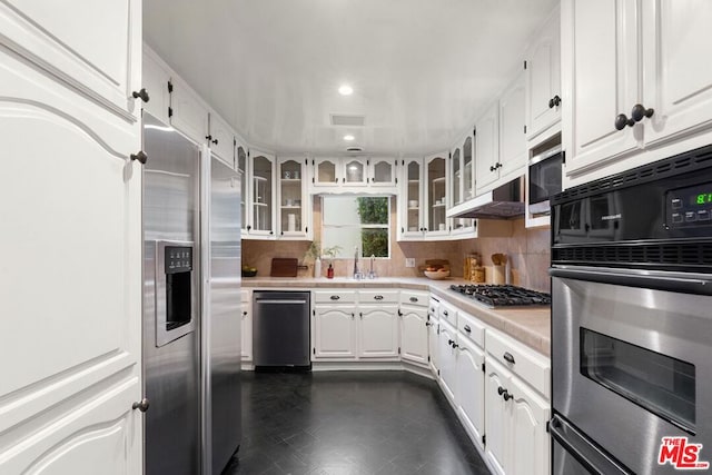 kitchen with sink, white cabinetry, and stainless steel appliances