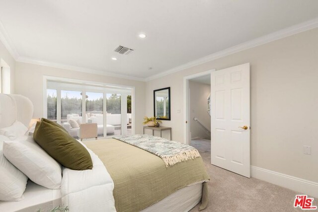 bedroom featuring carpet flooring and crown molding