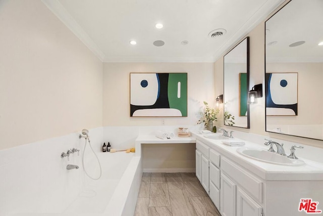 bathroom with a tub to relax in, vanity, and ornamental molding