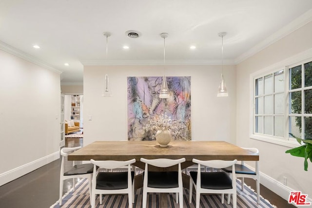 dining area featuring wood-type flooring and ornamental molding