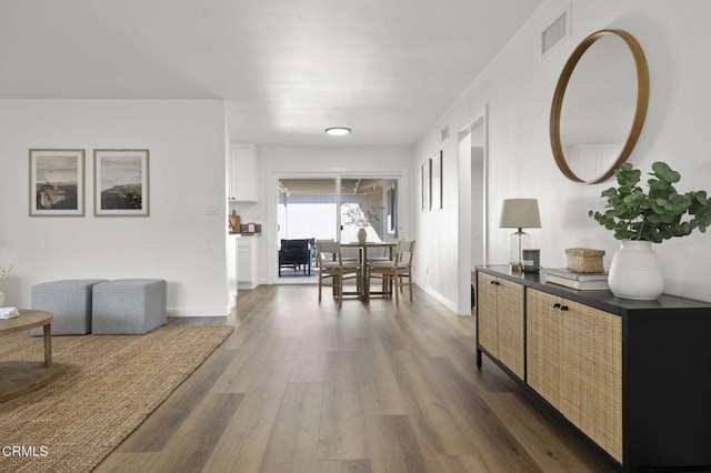 corridor featuring dark hardwood / wood-style flooring