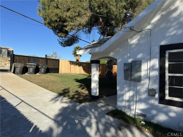 view of property exterior with a lawn