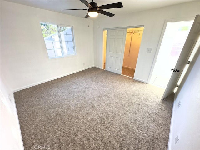 unfurnished bedroom featuring ceiling fan, carpet, and a closet