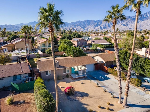 birds eye view of property featuring a mountain view