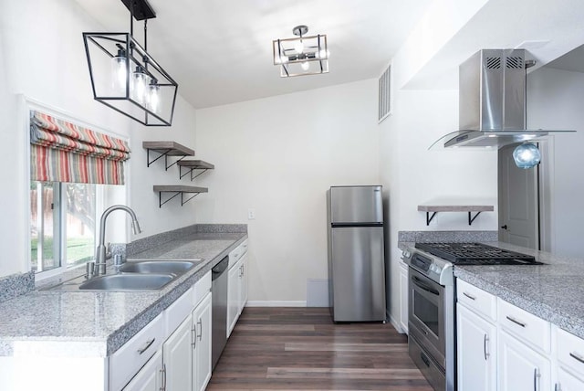 kitchen featuring sink, white cabinets, island range hood, and stainless steel appliances